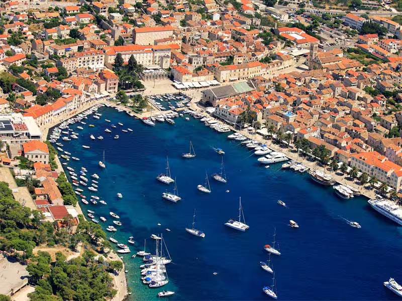Overhead view of Hvar Town marina packed with sailboats, a highlight of Hvar Brac Solta private boat trip