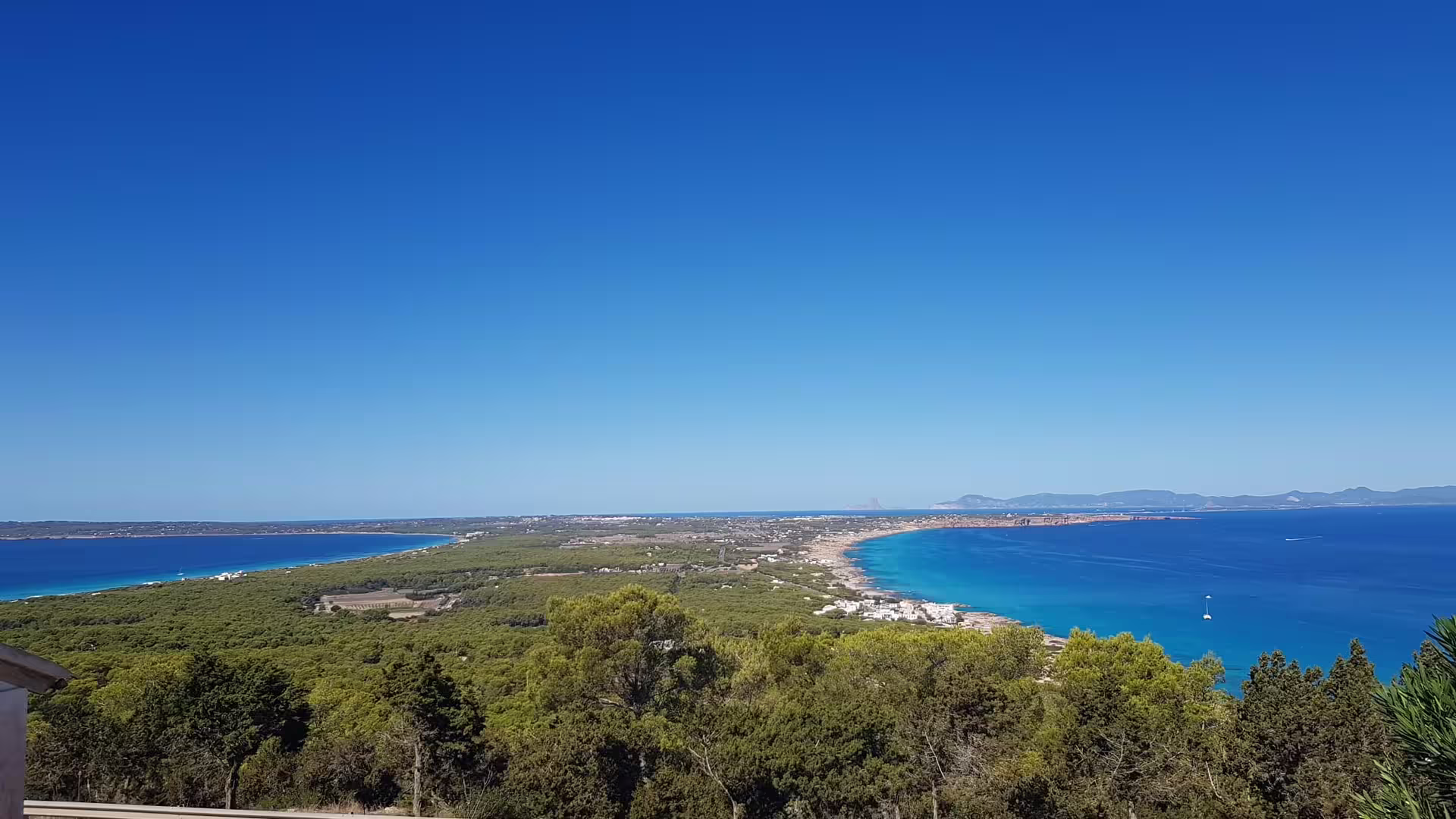 Panoramic Ibiza coastline viewpoint with turquoise bays, ideal stop on Ibiza bus tour with fast ferry and guide