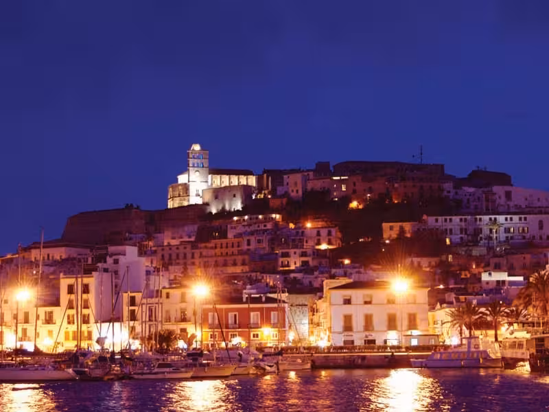 Ibiza Old Town Dalt Vila skyline at night from the marina, ideal for an official guided tour