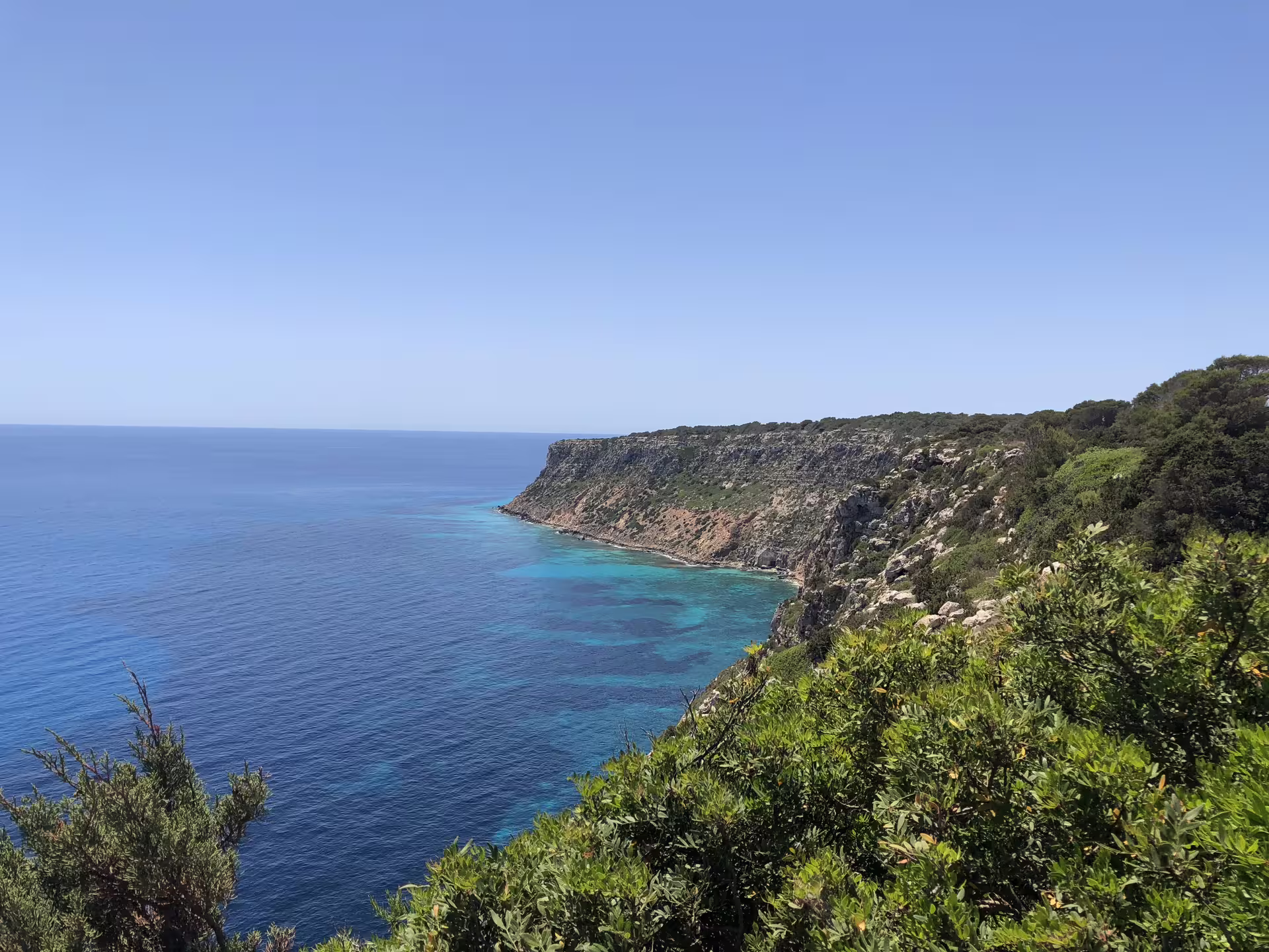 Panoramic Ibiza coastal cliffs and turquoise sea viewpoint on official guided bus tour with fast ferry day trip