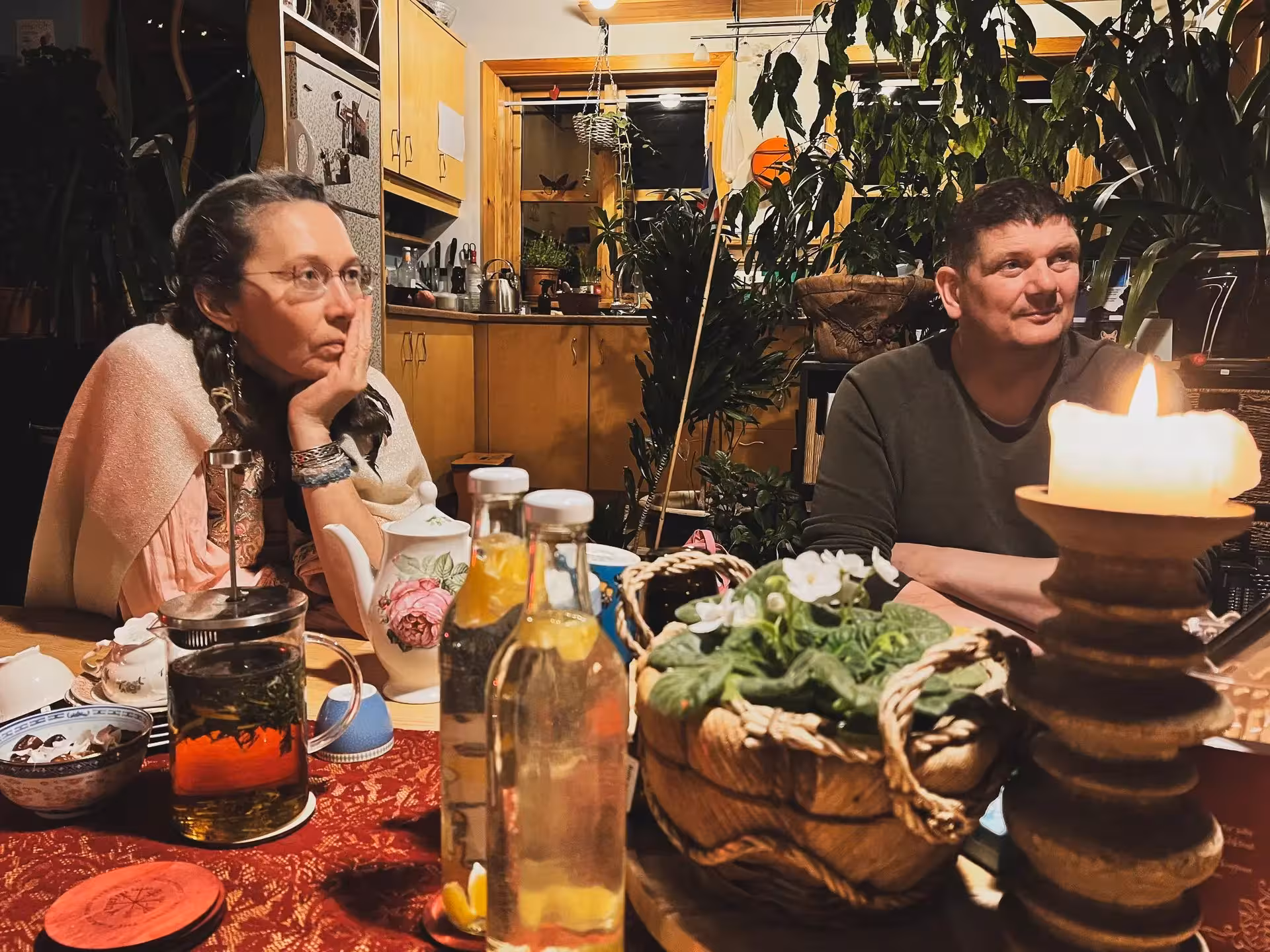 Cozy cacao ceremony in Iceland, candlelit table and guests sharing Christmas dreams on Sacred Iceland tour