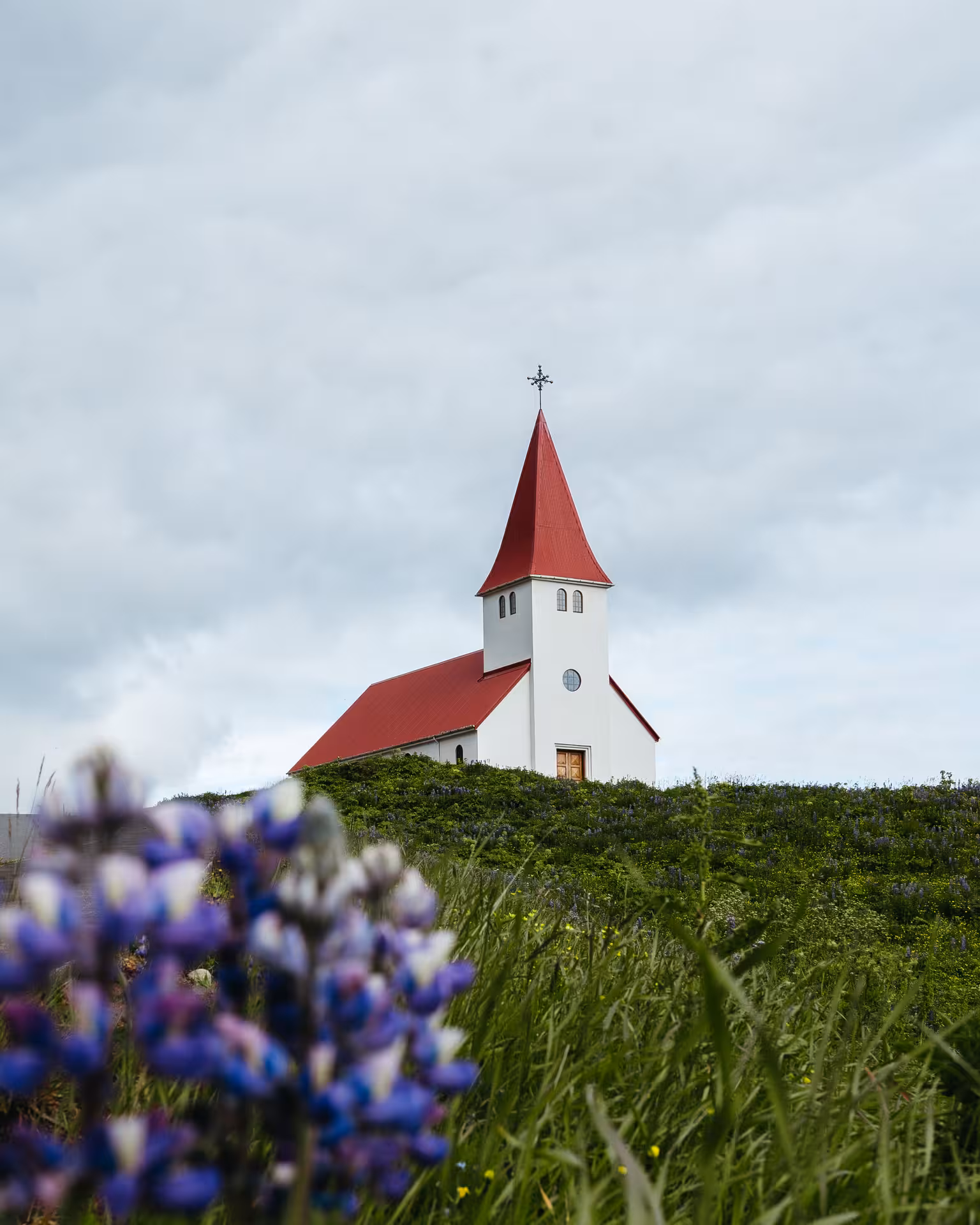 Red-roof Iceland church on South Coast stop near Vík, featured on Sólheimajökull glacier hike day tour