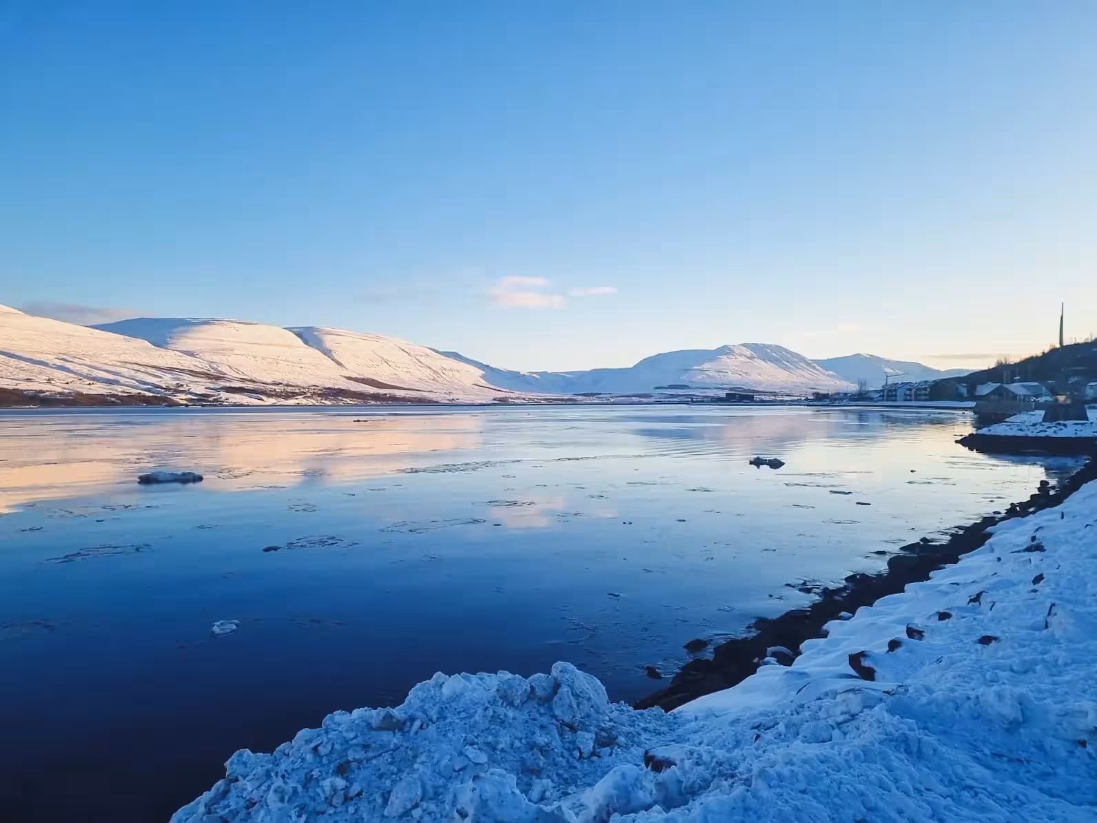 Winter fjord view with snowy mountains in Iceland, scenic stop on private Goðafoss waterfall tour