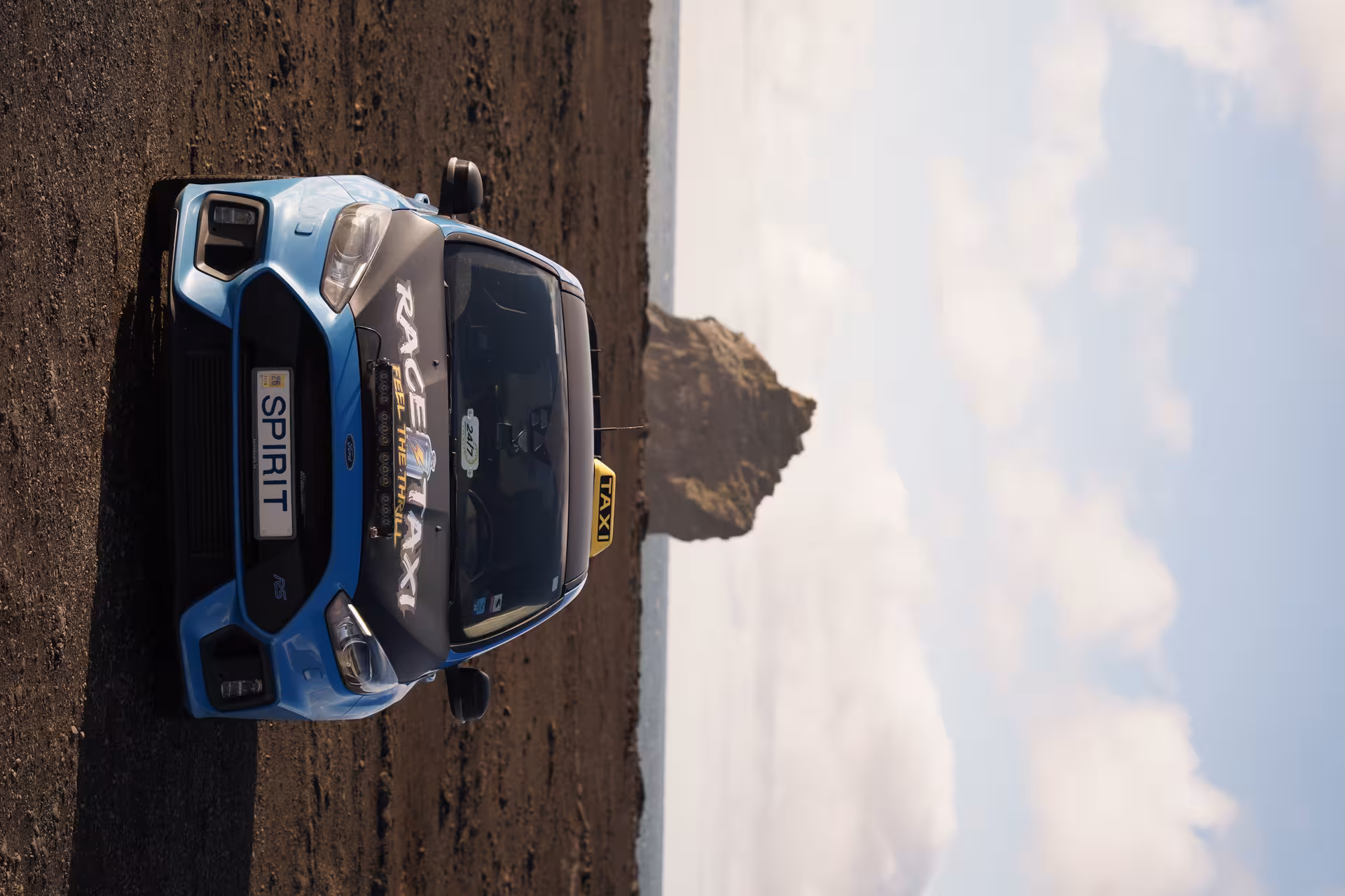 Iceland rally car taxi private airport transfer on black sand beach, ready for KEF pickup and drop-off