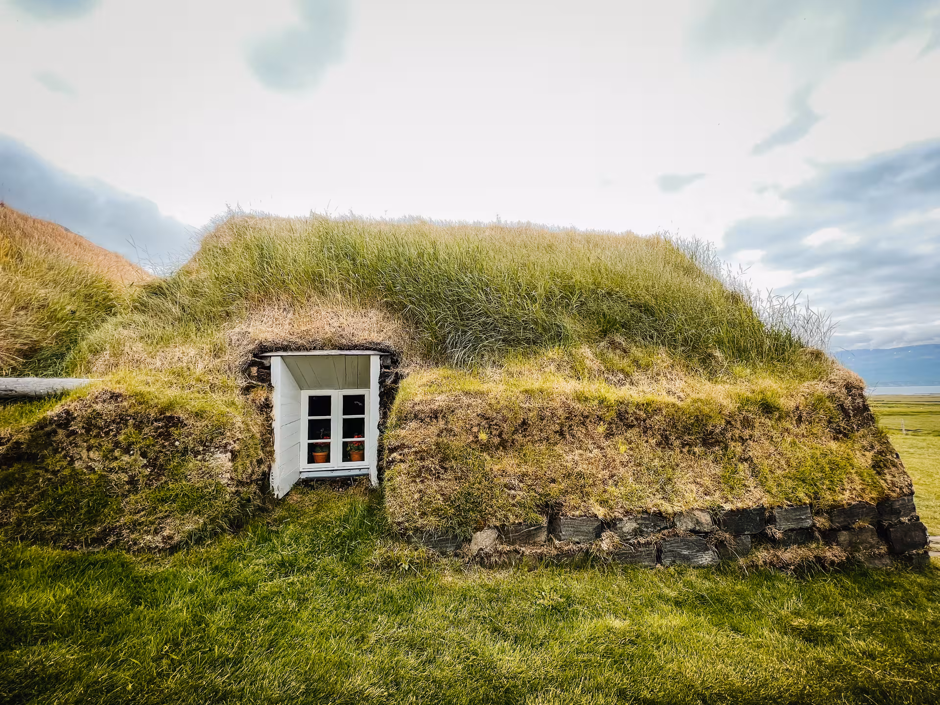 Traditional Icelandic turf home at Laufás Museum on Akureyri Port tour, cultural stop before Goðafoss and lagoon