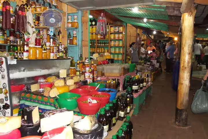 Vibrant local market near Iguazu Falls featuring diverse products and cultural insights on a guided tour.
