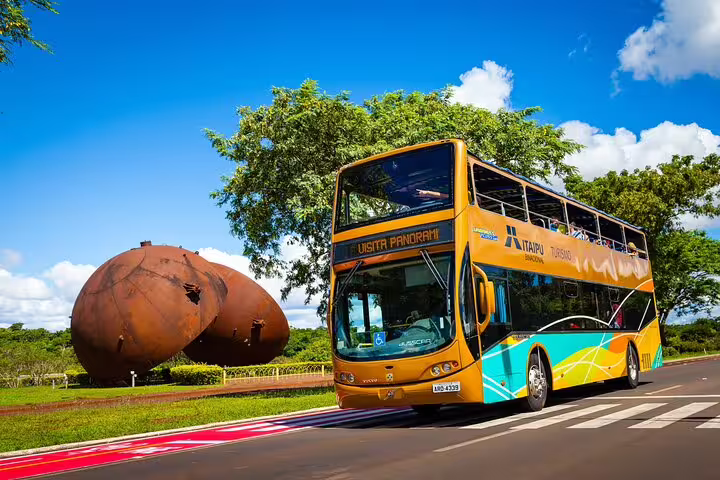 A vibrant double-decker tour bus near Iguazu Falls, perfect for sightseeing during a 4-day private guided tour.