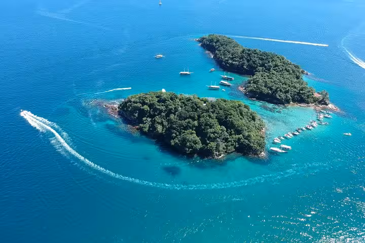 Aerial view of Ilha Grande's lush green islands surrounded by turquoise waters, ideal for a scenic schooner tour.