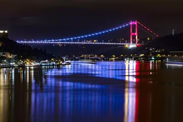 Illuminated Bosphorus Bridge at night with reflections, private Istanbul by night sightseeing tour view