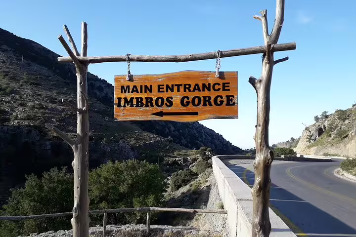 Entrance sign to Imbros Gorge marks the start of an exciting private hiking tour through stunning landscapes.