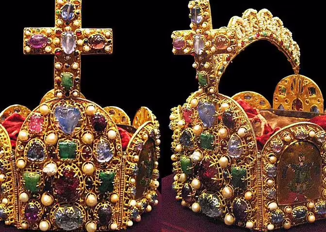 Close-up of a richly adorned imperial crown with jewels, highlighting the opulence of the Imperial Treasury collection.