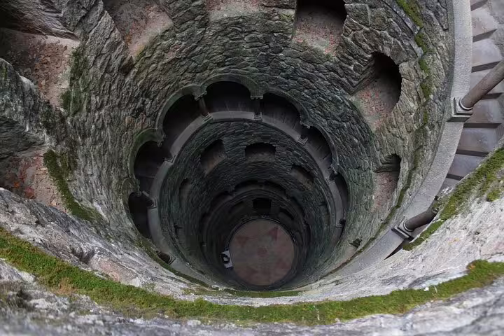View of the Initiation Well at Quinta da Regaleira in Sintra, Portugal, a mystical stop on the Lisbon day trip tour.