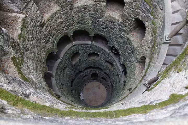 View of the enchanting Initiation Well at Quinta da Regaleira, a highlight on the private Sintra tour from Lisbon.