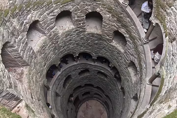 Explore the mystical Initiation Well at Quinta da Regaleira on a private Sintra tour, revealing its spiral staircases and enchanting history.