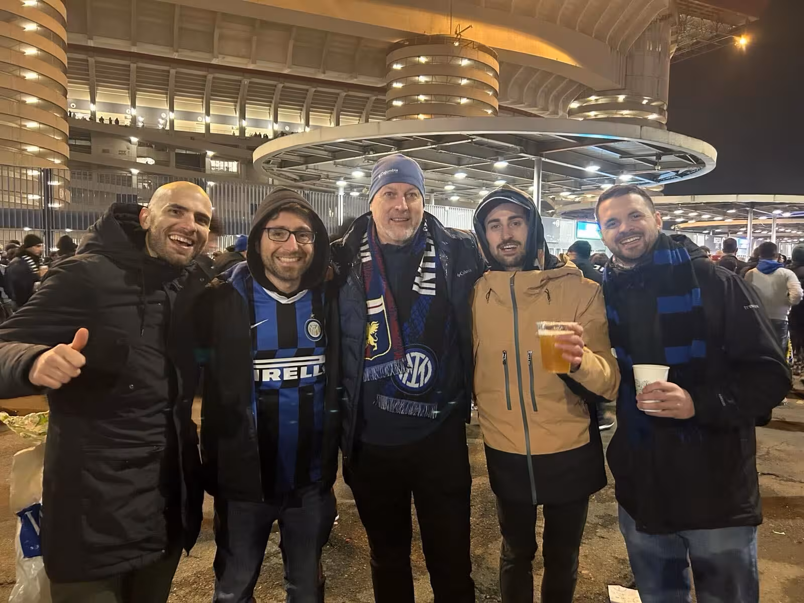 Inter fans pose outside San Siro before a Milan football match, joining locals for pregame atmosphere