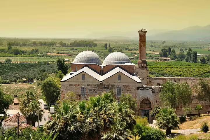 Discover the beautiful Isa Bey Mosque near Ephesus, showcasing Ottoman architecture with picturesque countryside views.