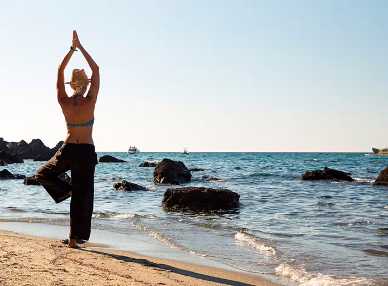 Relaxing beach yoga on Ischia near Poseidon Thermal Gardens, ideal day trip with hydrofoil and transfer