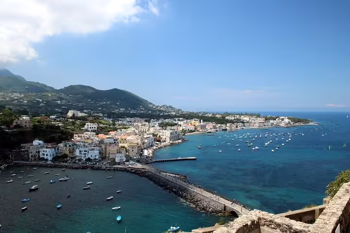 Scenic view of Ischia Island's vibrant coastline and marina from a full-day boat tour departing Naples.