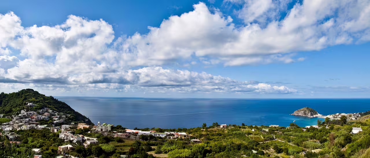 Wide panorama of Ischia coastline near Sant’Angelo and Maronti Beach, tour from Naples with transfers