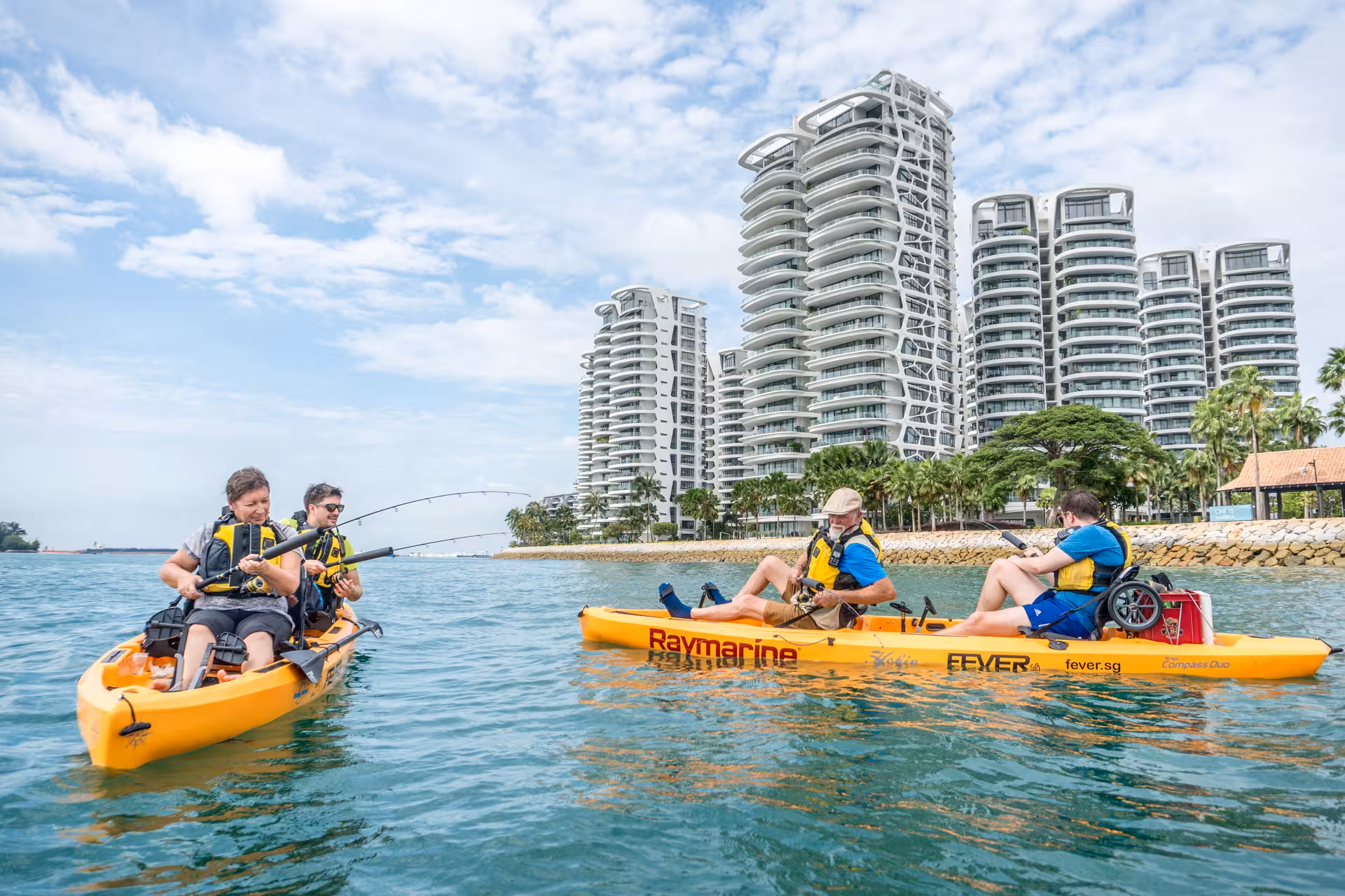 Group enjoying kayak fishing near luxury condos on Lazarus Island tour.