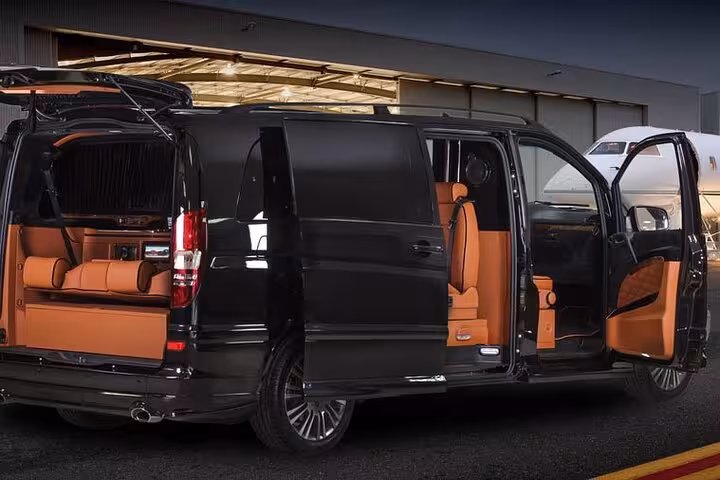 Executive VIP van at Istanbul airport for private transfer, sliding door open with premium leather seats and luggage space