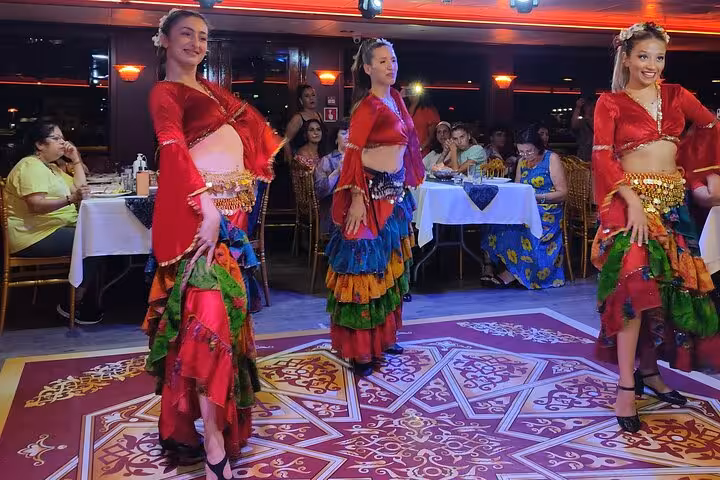 Turkish Night belly dancers performing on Istanbul Bosphorus dinner cruise with private table seating