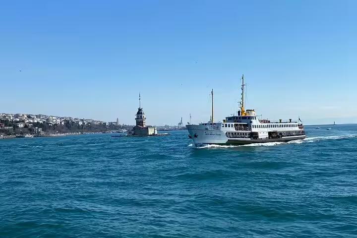 Istanbul Bosphorus ferry cruising past Maiden’s Tower, included on 8-day Turkey mini group tour by flights