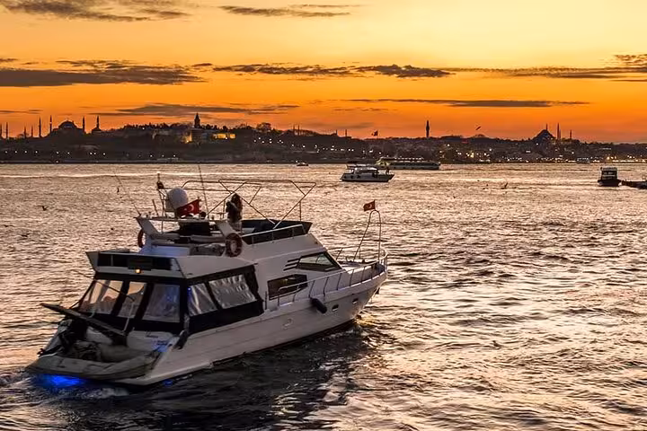 Private Istanbul Bosphorus yacht cruise at sunset with skyline views and calm waters around the boat