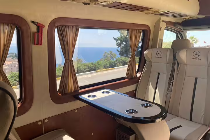 Luxury minibus interior with table on Istanbul to Cappadocia tour transfer, relaxing ride to cave hotel