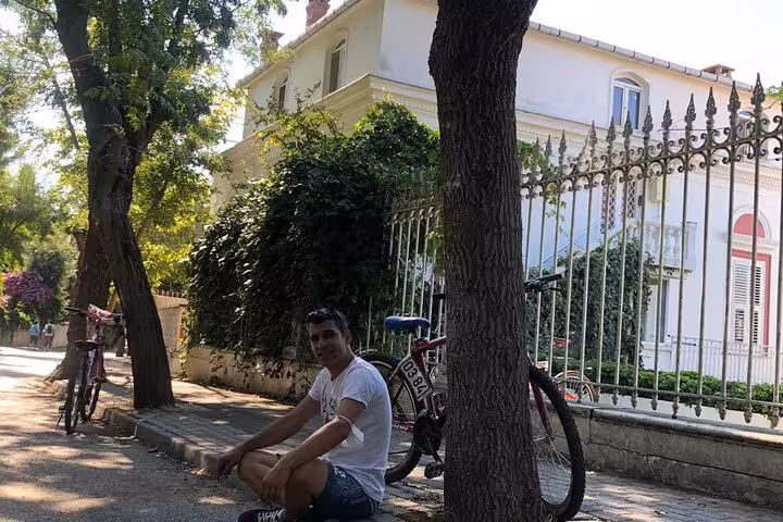 Rest stop by historic Büyükada mansion and bikes on Istanbul Princes Islands tour including Heybeliada