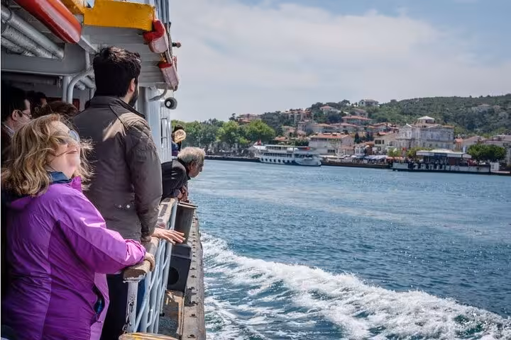 Passengers on Istanbul ferry approaching Büyükada waterfront, part of Princes Islands tour with Heybeliada