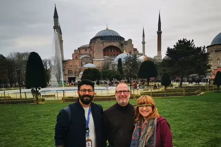 Tourists enjoying a private guided tour at Hagia Sophia with a view from Galata Port in Istanbul.