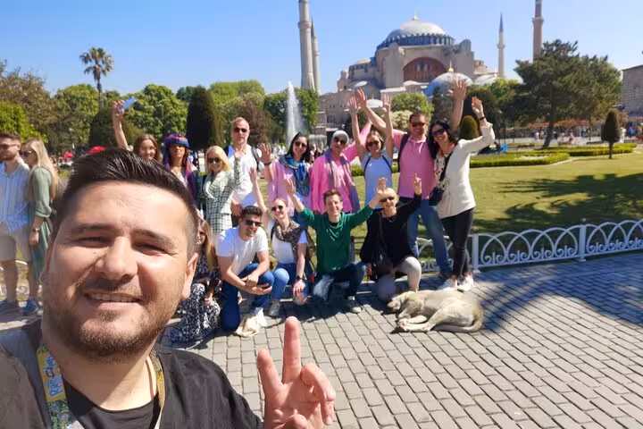Happy small-group Istanbul tour photo in Sultanahmet Park with Hagia Sophia in the background