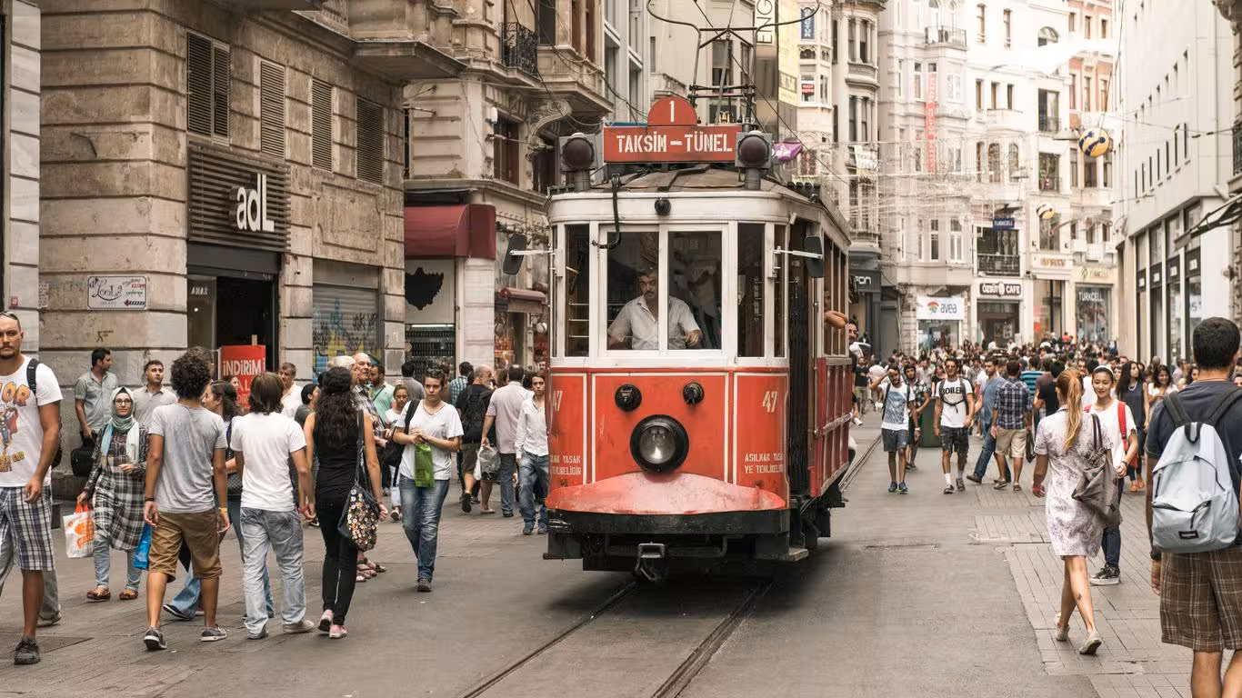 Red tram on a busy Istanbul street