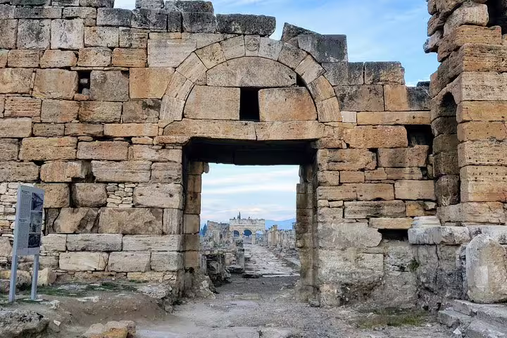 Stone gate entrance to ancient city ruins on Seven Churches of Asia Minor tour from Istanbul, 4 nights