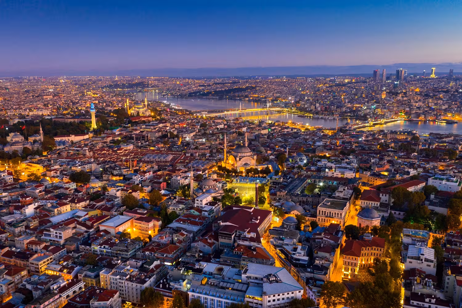 Istanbul city skyline at dusk with lights and rooftops