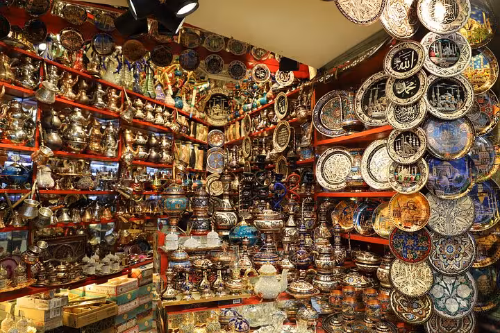 Spice Bazaar shop packed with Turkish lamps, copperware and mosaic plates on Istanbul Old City tour with lunch
