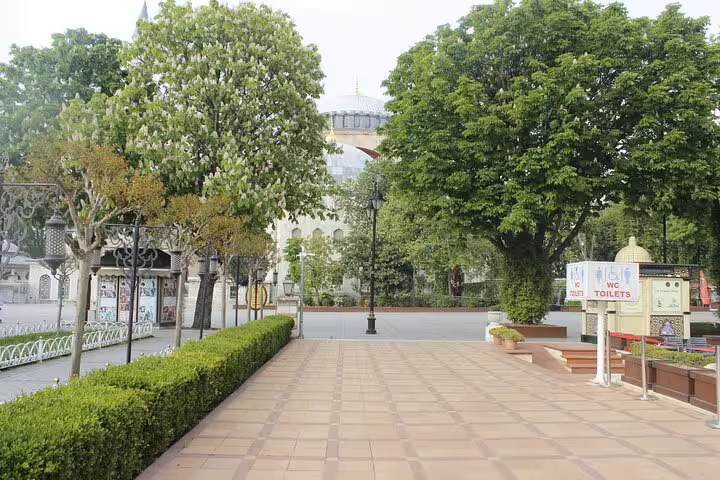 Sultanahmet Square gardens and path with Hagia Sophia dome view on Istanbul Old City full-day tour