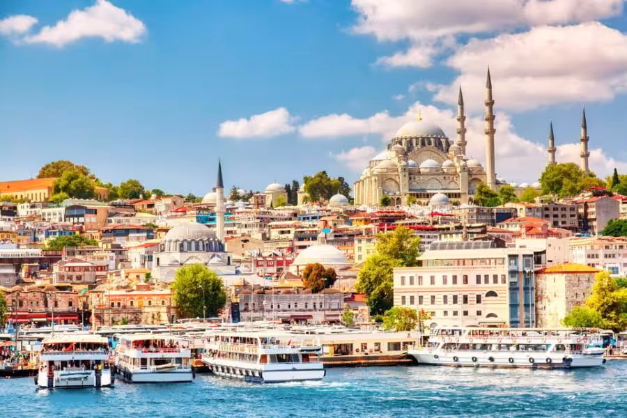 Istanbul waterfront cityscape with boats and skyline