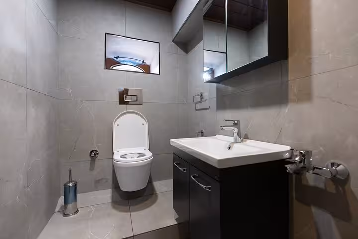 Modern yacht bathroom with sink and toilet onboard a private Istanbul Bosphorus yacht cruise in Turkey