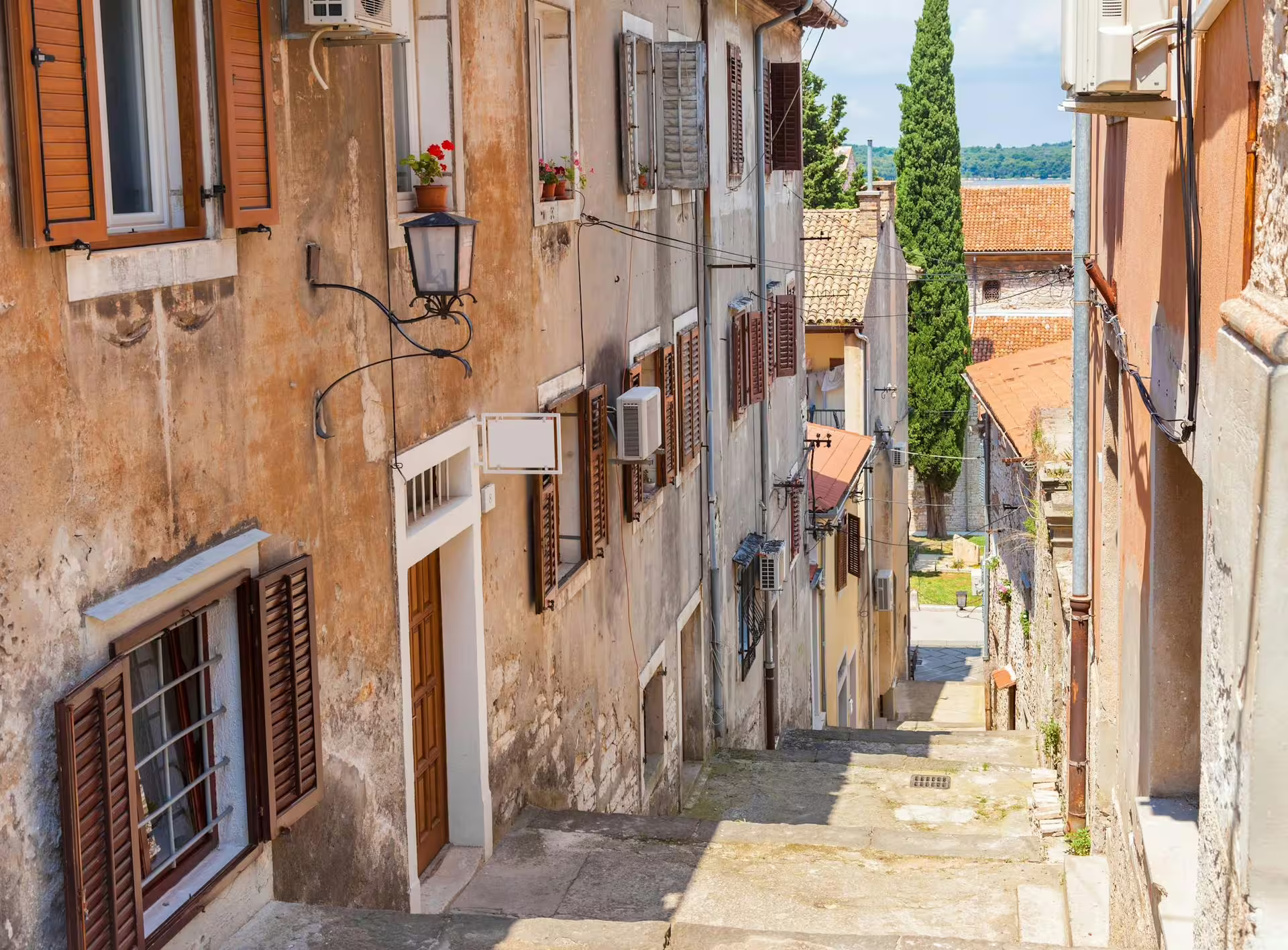 Charming Istrian old town alley near Rovinj on Ancient Istria tour to Pula with traditional lunch included