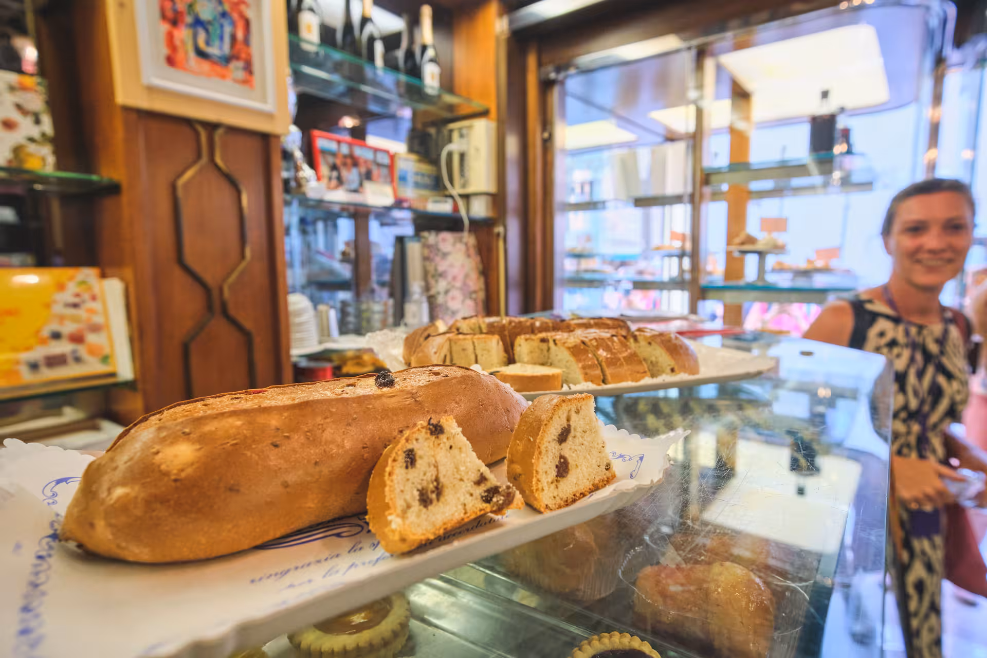 Traditional Italian bakery in Lucca featuring fresh pastries on display during a Pisa and Lucca tour from Florence.