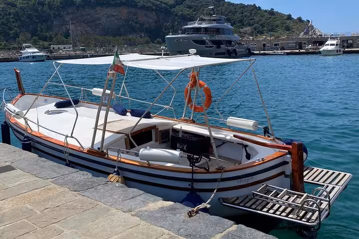 Traditional Italian boat docked in La Spezia harbor, perfect for exploring Portovenere and Lerici on a scenic tour.