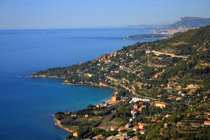 Aerial view of the Italian coast with lush greenery and turquoise waters, perfect for a customizable private tour.