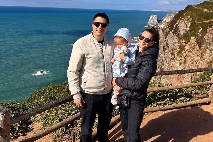 Family enjoying stunning ocean views at Cabo da Roca on the 007 Sintra and Atlantic Coast private tour.