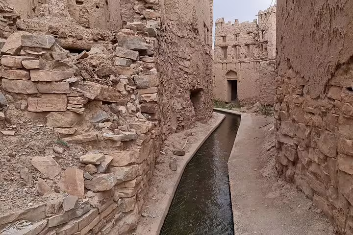 Explore the ancient stone architecture and narrow water channels in Jebel Akhdar's Al Suwjara Village on a private tour.
