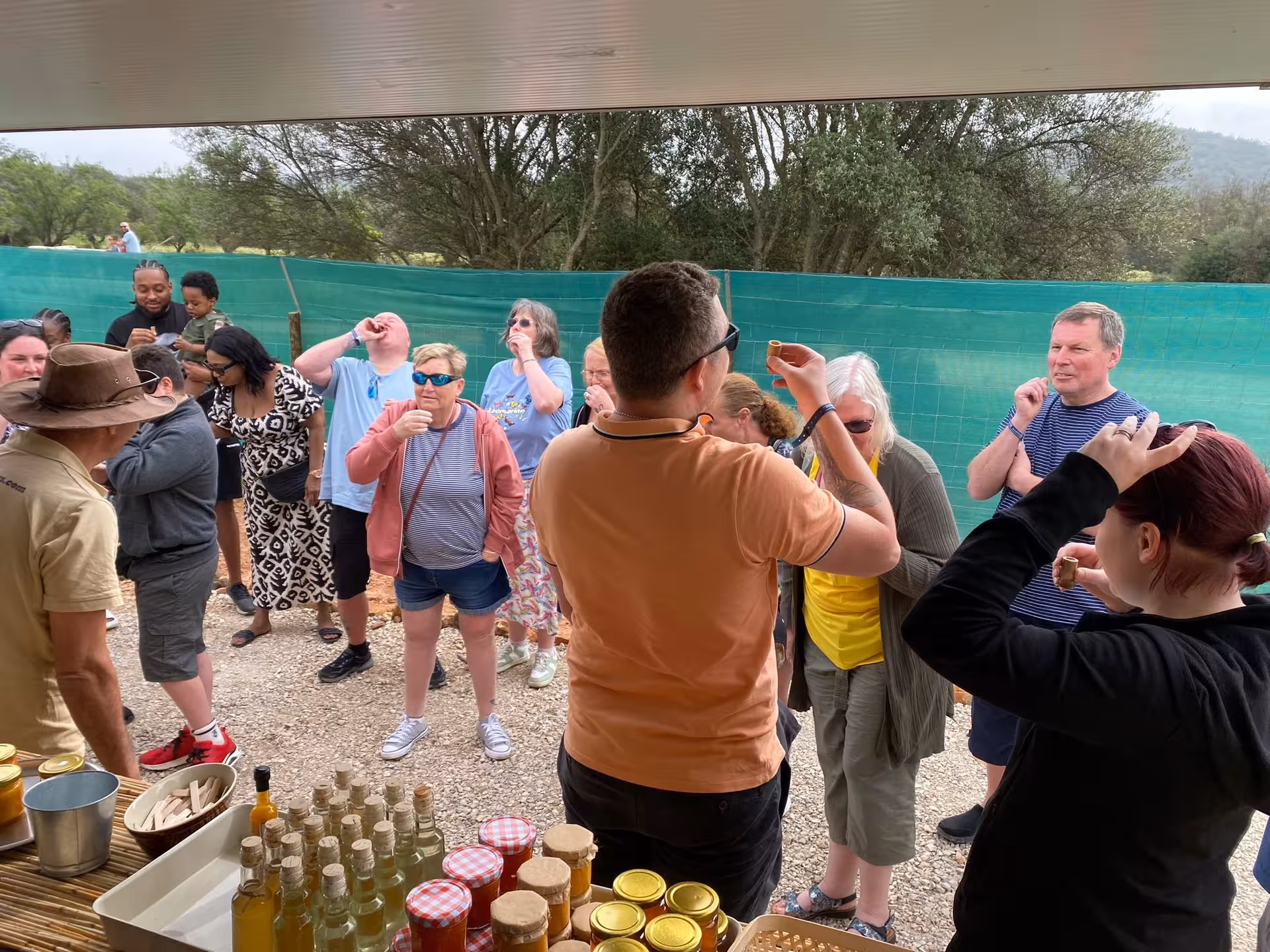 Group of Jeep safari guests tasting Algarve liqueurs and local products during a countryside stop on a full day tour
