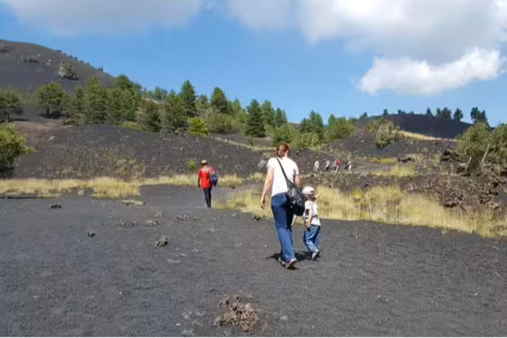 4x4 jeeps on black lava field during Full-Day Mount Etna Jeep Tour from Taormina with guided stops