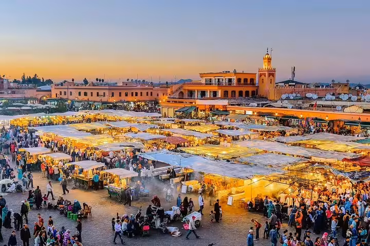 Evening lights at Jemaa el-Fnaa market in Marrakech medina, cultural stop on an 8 day desert tour from Marrakech