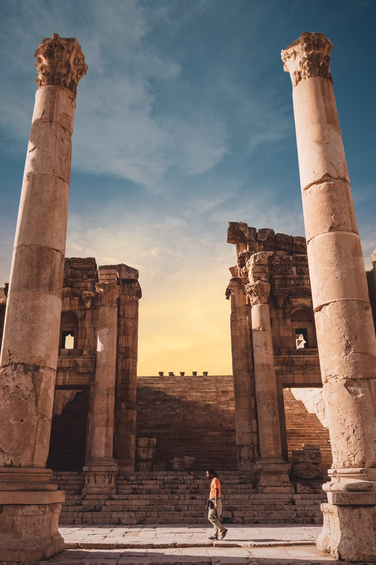Sunset view of Jerash ancient ruins with towering Roman columns, Timeless Jordan guided cultural tour